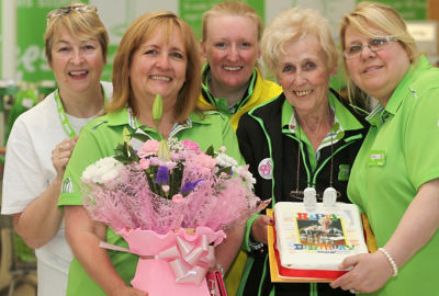 Colleagues help Margy celebrate her 80th birthday