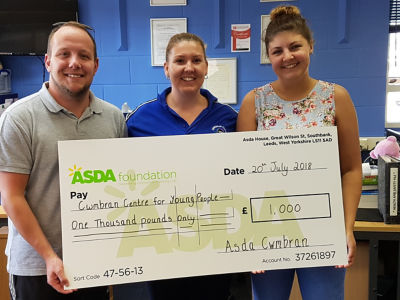 Kate Box from Asda Cwmbran presenting Cwmbran Centre for Young People with a Healthy Holiday Fund grant