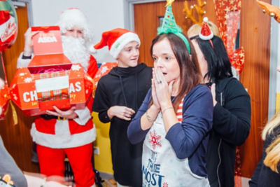 Elizabeth Williams from Canolfan Pentre receiving a £10,000 Christmas surprise from Asda