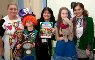 Asda Bristol Patchway community champion Caroline with teachers and pupils for World Book Day at Elmfield School for Deaf Children