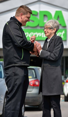 Asda Royston colleague Scott Lettin with customer Dot Broadley