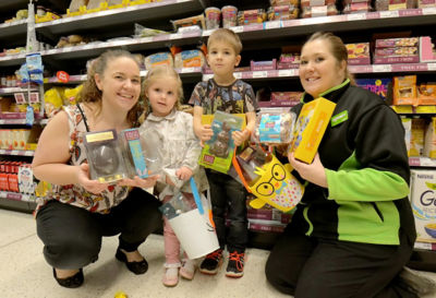 Asda Stockton community champion Michaela hands over some dairy free Easter treats