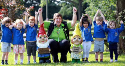 Asda Shirley community champion Sandra Grice with nursery school pupils