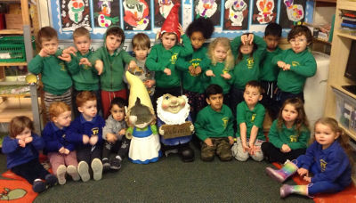 Tidbury Green Private Nursery pupils with the damaged Asda giant gnomes