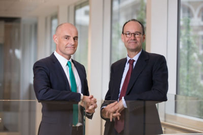 Two retail executives stand together