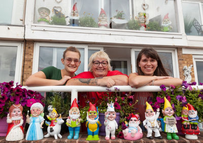 Janet Wilson and her daughters Adel and Karina with their collection of Asda gnomes.