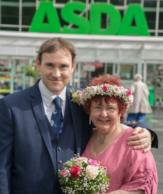 Gill and Lee outside the store