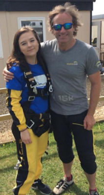 Asda Highbridge colleague Leia Smith with a skydive instructor