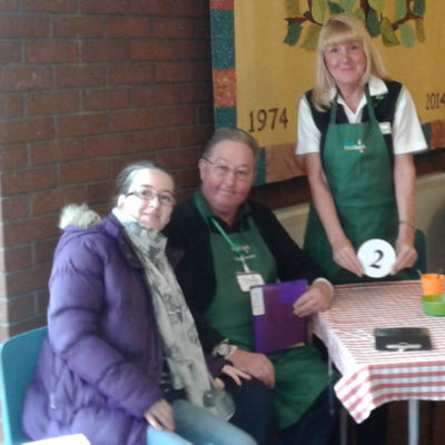 Asda Leigh community champion Gwen with the foodbank's cheque