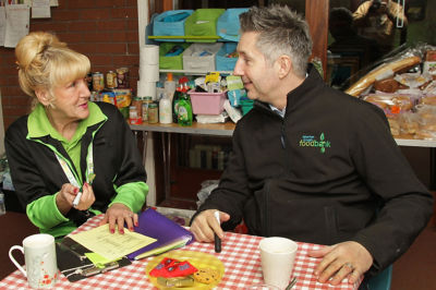 Asda Leigh community champion Gwen with Warren from the foodbank
