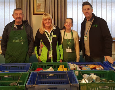 Asda Leigh community champion Gwen with foodbank volunteers