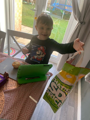 Logan Hutchison with his Asda Scan & Go carrier bag