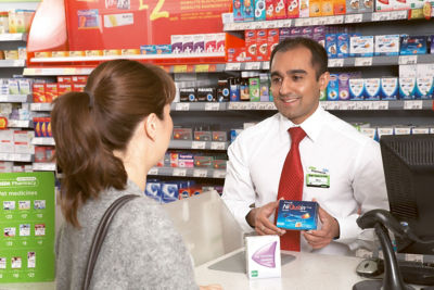 Maq Din with a customer in Asda