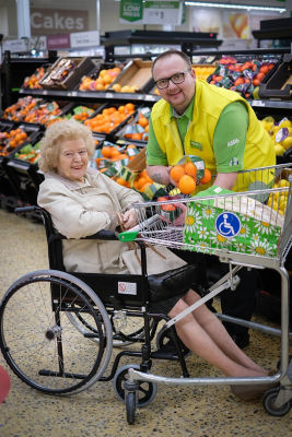James Phelan from Asda Blackpool helps Gladys Dixon with her shopping