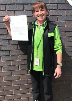 Lynn Bryce from Asda Newquay with her letter of thanks from the US Embassy