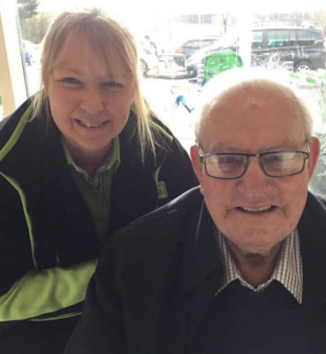 Asda Llangefni customer Norman with colleague Wendy