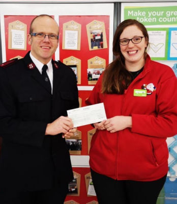 Zoe Scarisbrick from Asda Peterhead presents a Christmas grant to the Salvation Army