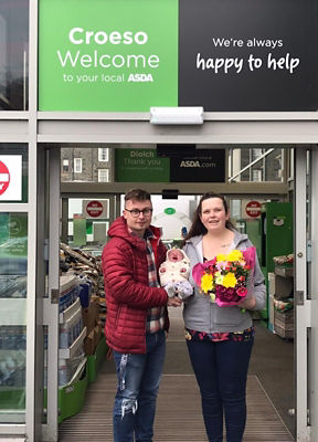 Dean Stawman and Delyth Jones with baby Harry who was born in the Asda Pwllheli car park