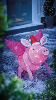 Flying pig light outdoors