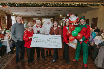 Elaine Livingstone from Asda Portadown celebrates the NHS's 70th anniversary with Gareth McGreevy from the Children's Heartbeat Trust