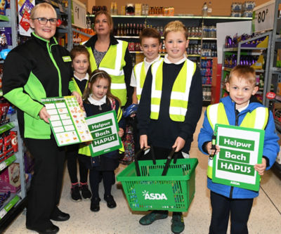 Asda Pwllheli community champion Jo Scott with Twm