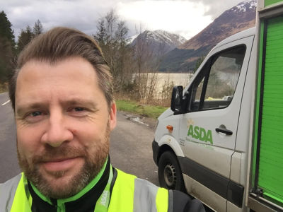 Robbie Hope with Asda van in picturesque scenery of North West Scotland