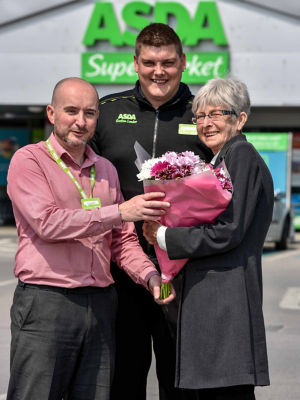 Asda Royston colleagues Richard Auty and Scott Lettin with customer Dot Broadley