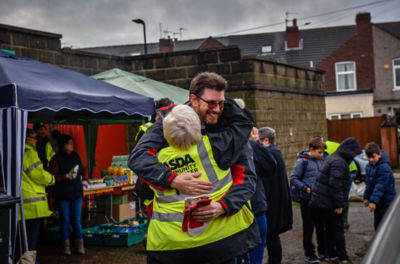 Asda colleagues help with the clean up operation after floods in Doncaster