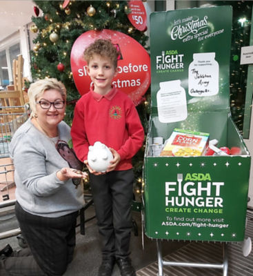 Seven-year-old George Jones spent all the money from his piggy bank in Asda Donnington Wood to help the local foodbank