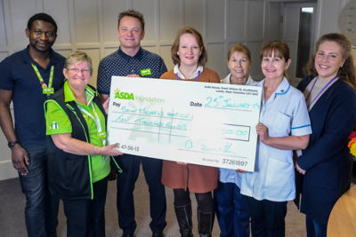 Angela Smith from Asda Harrogate presents a cheque for £10,000 to St Michael's Hospice