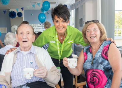 Asda Toryglen community champion Elizabeth Arbuckle with NHS birthday party guests