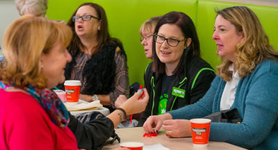 Asda Warrington community champion Liz Cotterill chats to guests at the community friendship meeting