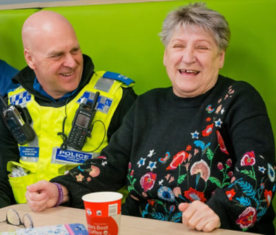 PCSO Colin Blanchard with a guest at Asda Warrington's community friendship group