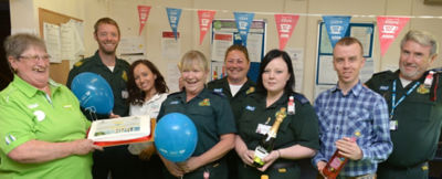 Angie Young from Asda Wheatley celebrates the NHS' 70th anniversary with South Central Ambulance Service 