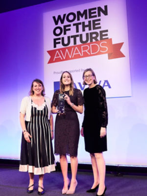 Alex Newbould collecting business award at women of the future awards